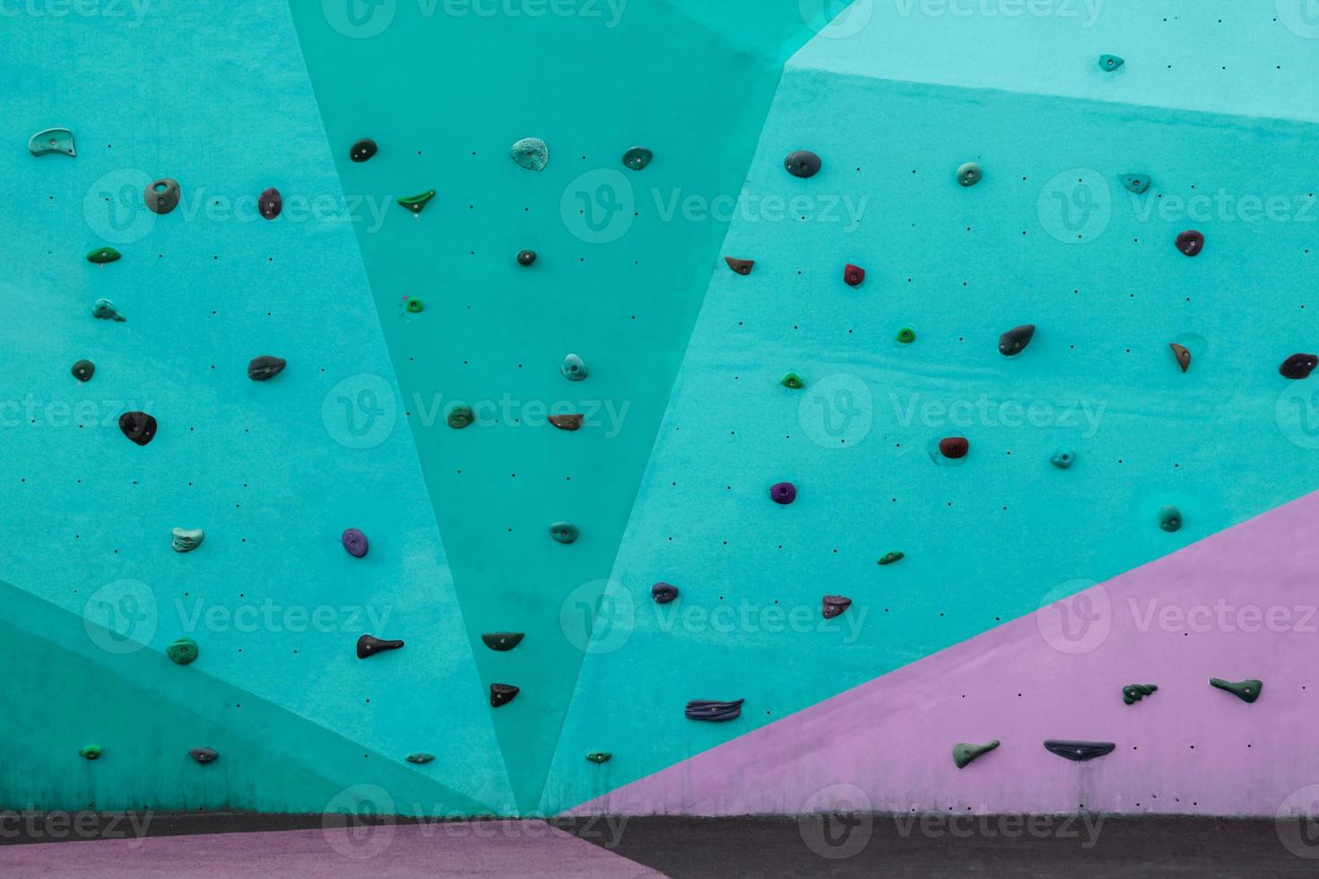 colorful rock climbing wall on the street photo