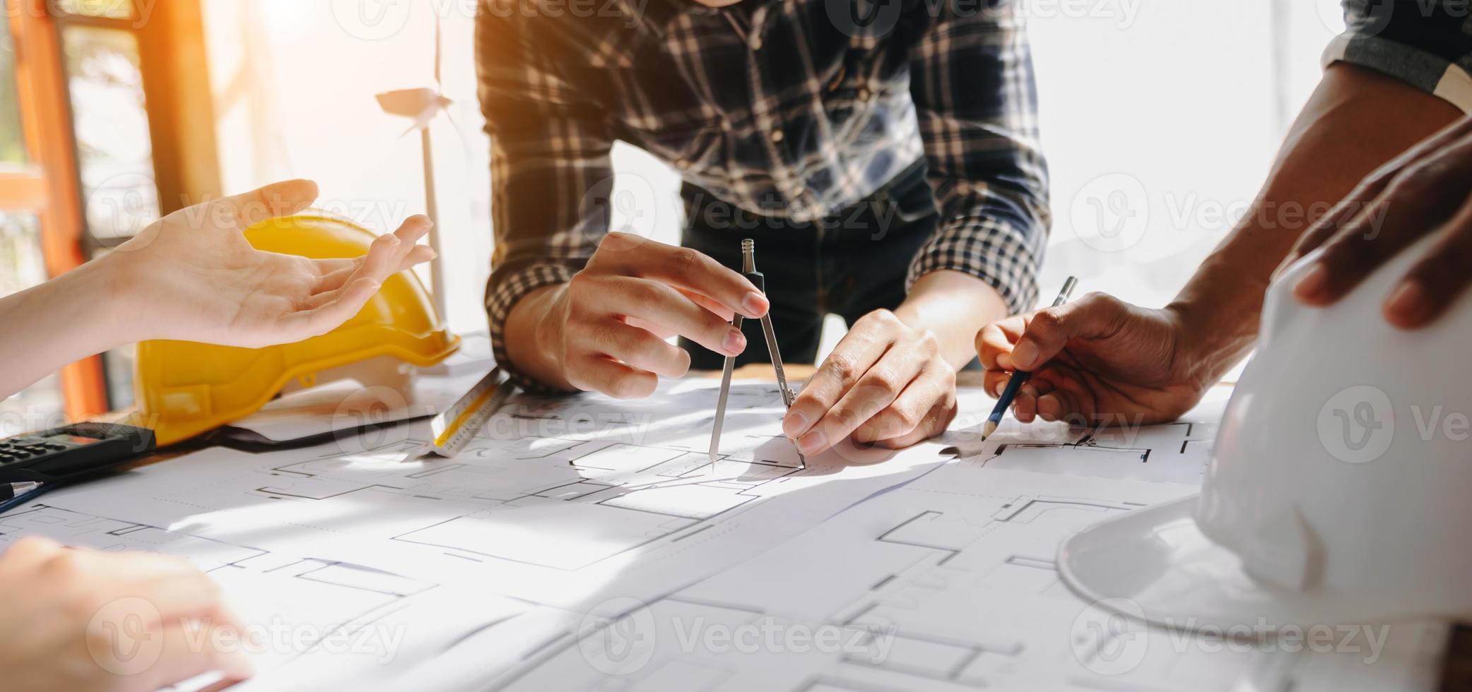 Confident team of architect working together in a office.Then discussing about new startup project on desk.in office photo