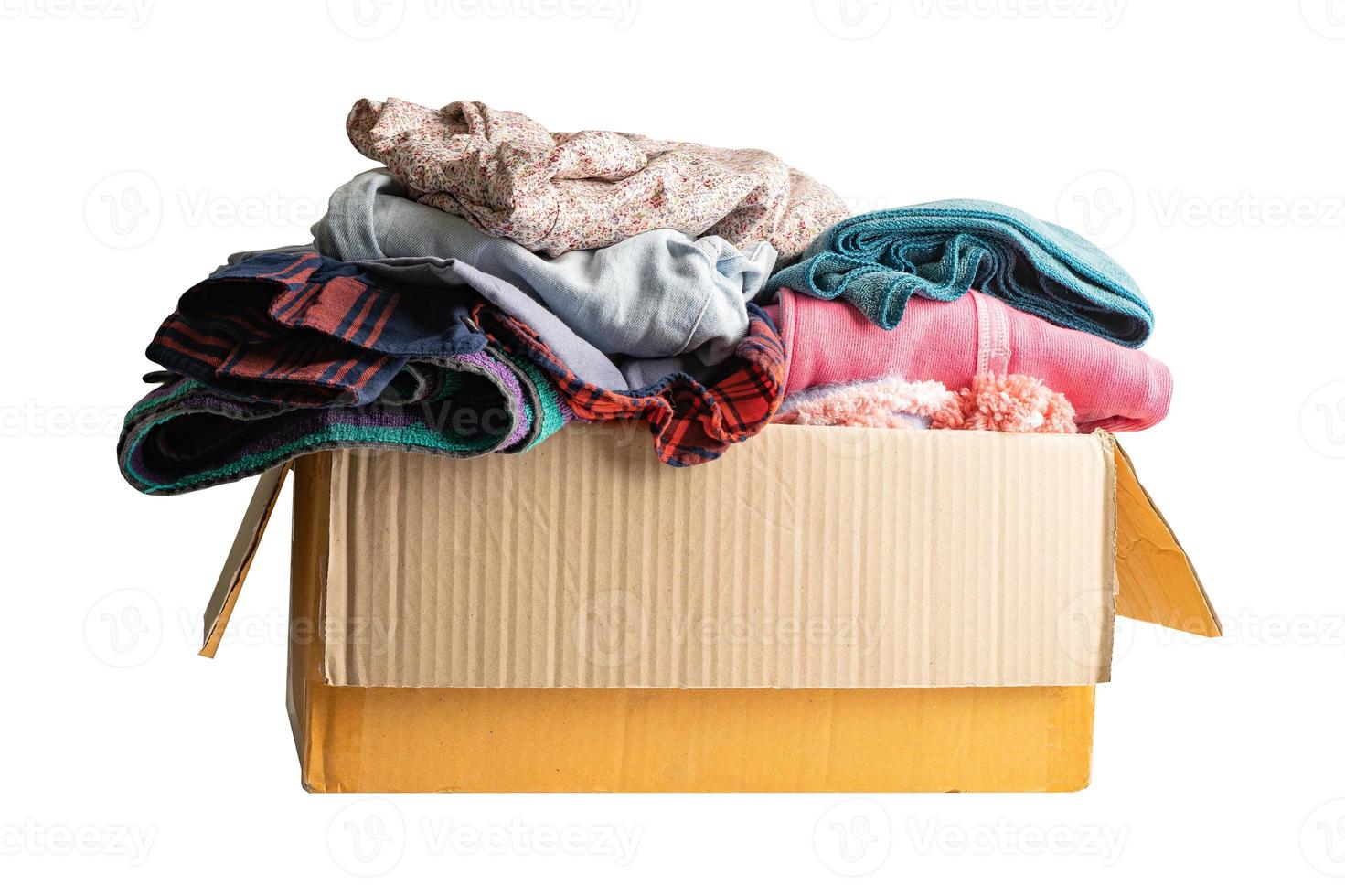 Donation box with used clothes isolated on white background with clipping path to support help for poor people in the world. photo