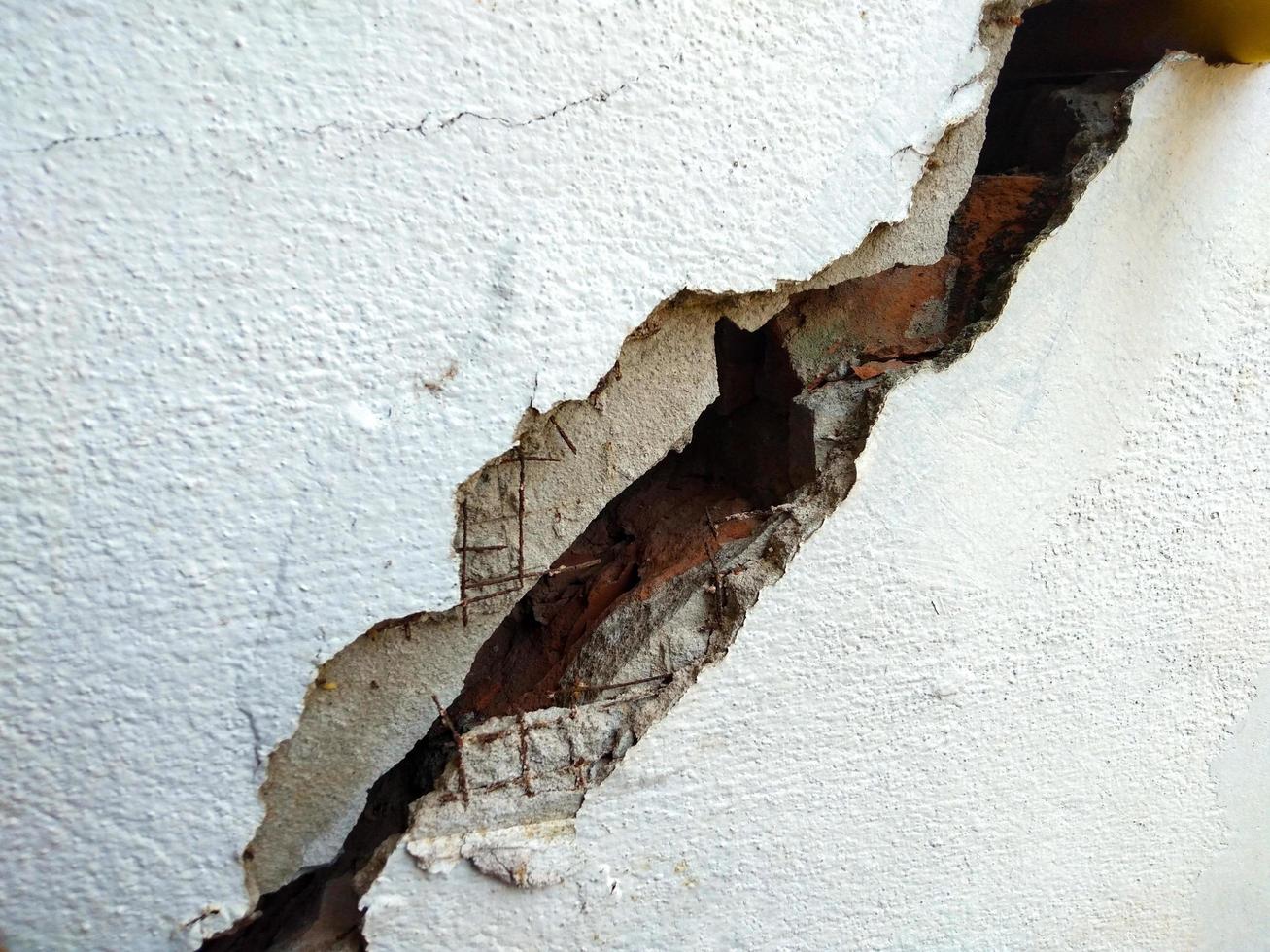 cracked concrete wall  the impact of landslides, earthquakes, geology, low-standard construction photo