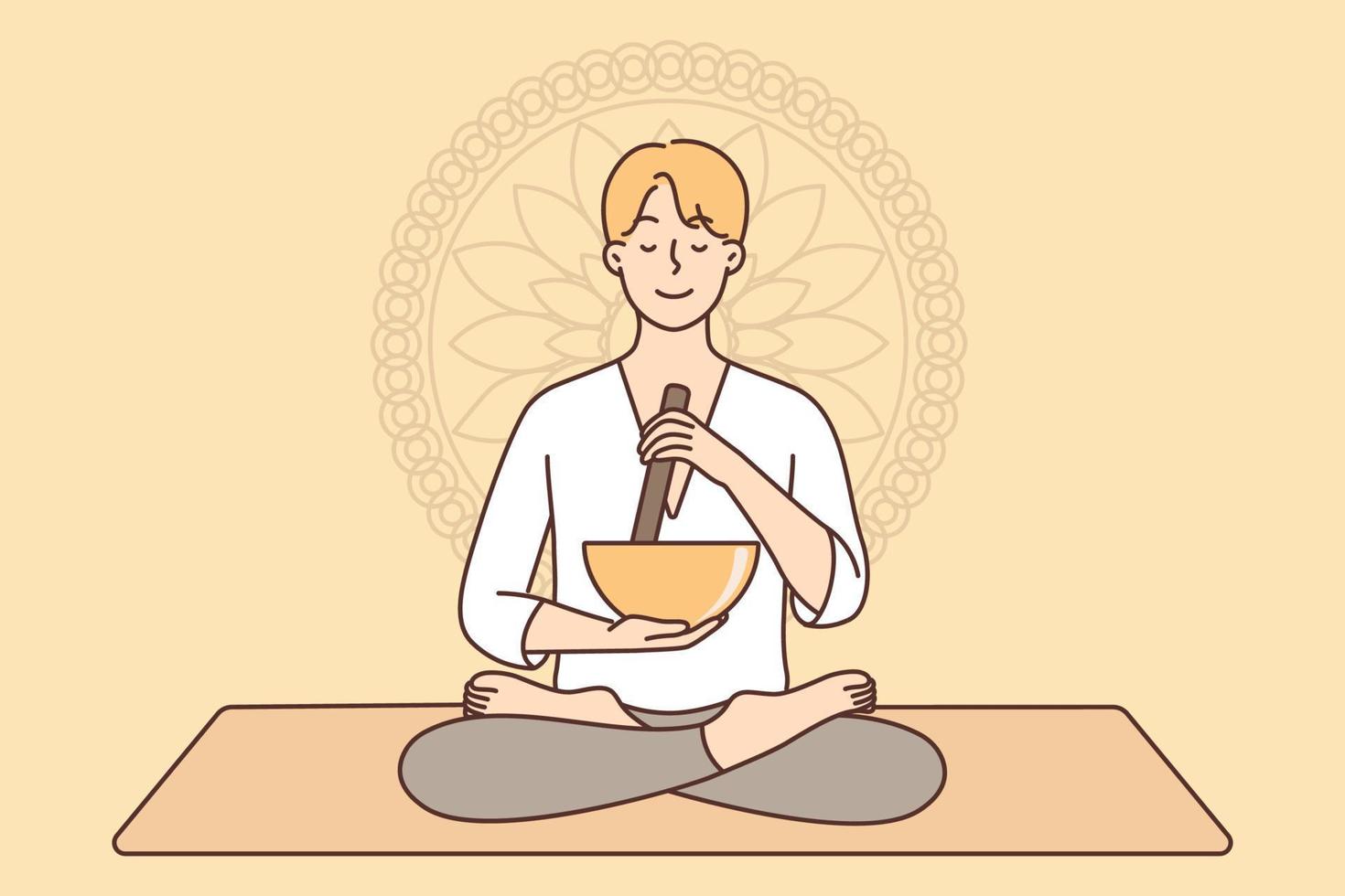 Meditating man sitting in lotus position on yoga mat using bowl to perform ancient ritual. Guy sits cross-legged near Buddhist symbol practices yoga and meditation to recuperate after work vector