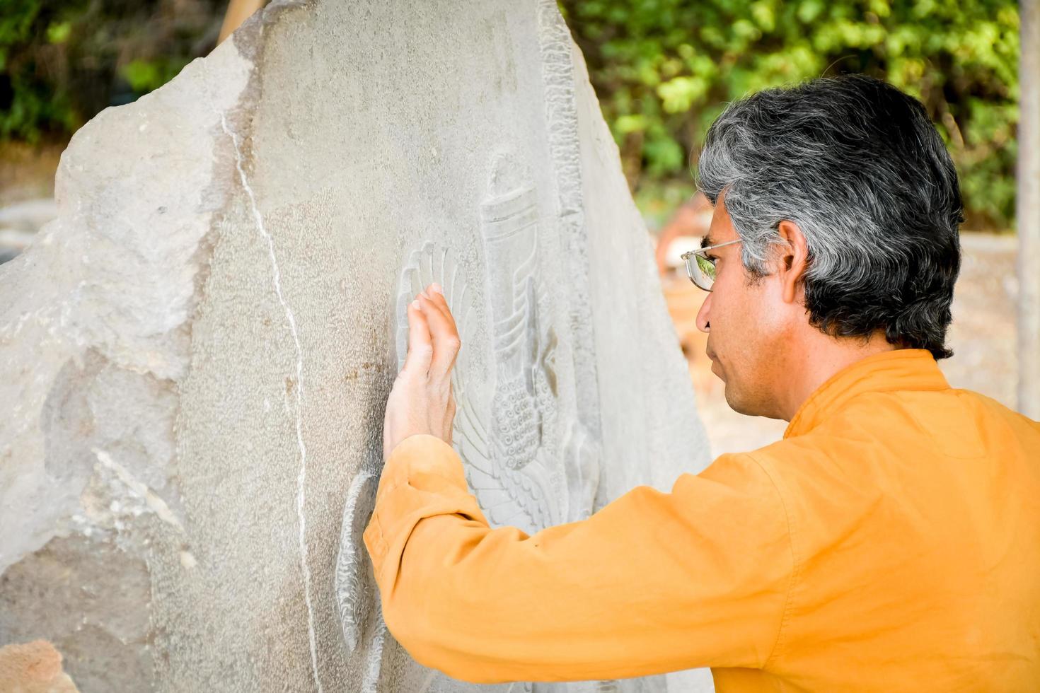 Persepolis, Iran -7th june, 2022 - Archeologist work on stone carvings in Persepolis, Iran. Preservation ancient persian city in Iran photo
