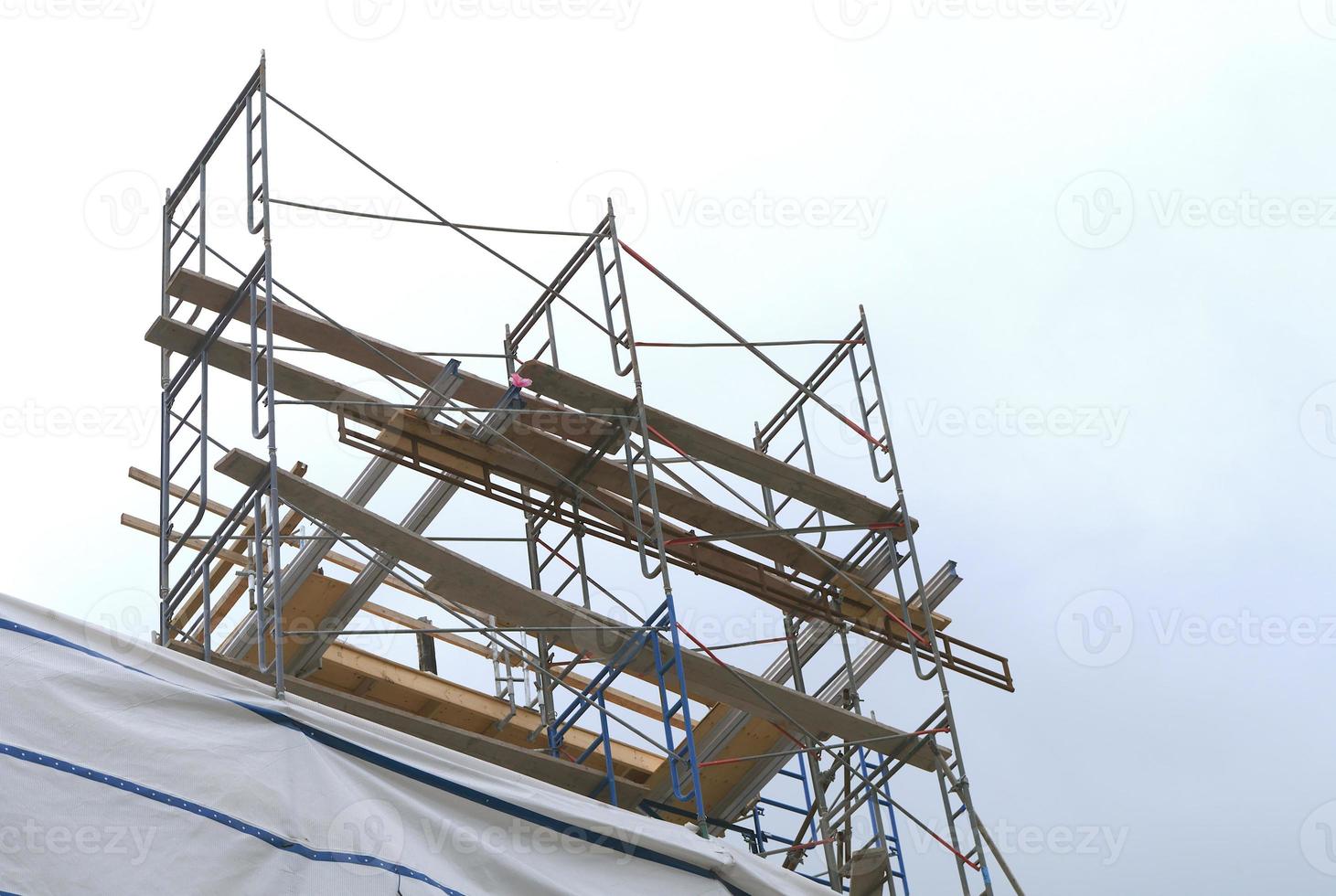 construction site working scaffold framework structure platform building development photo