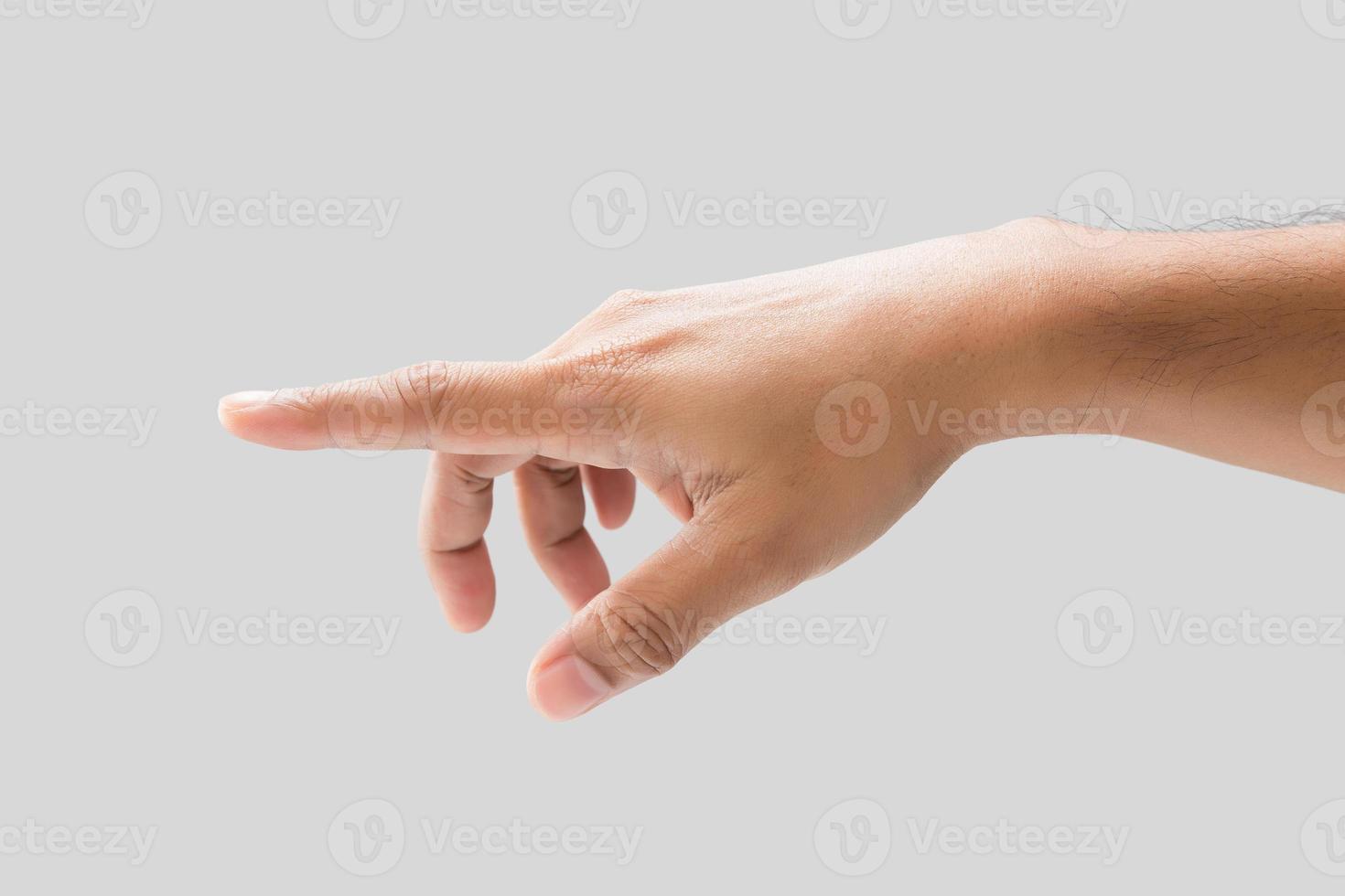 mano dedo señalando en un gris antecedentes. foto