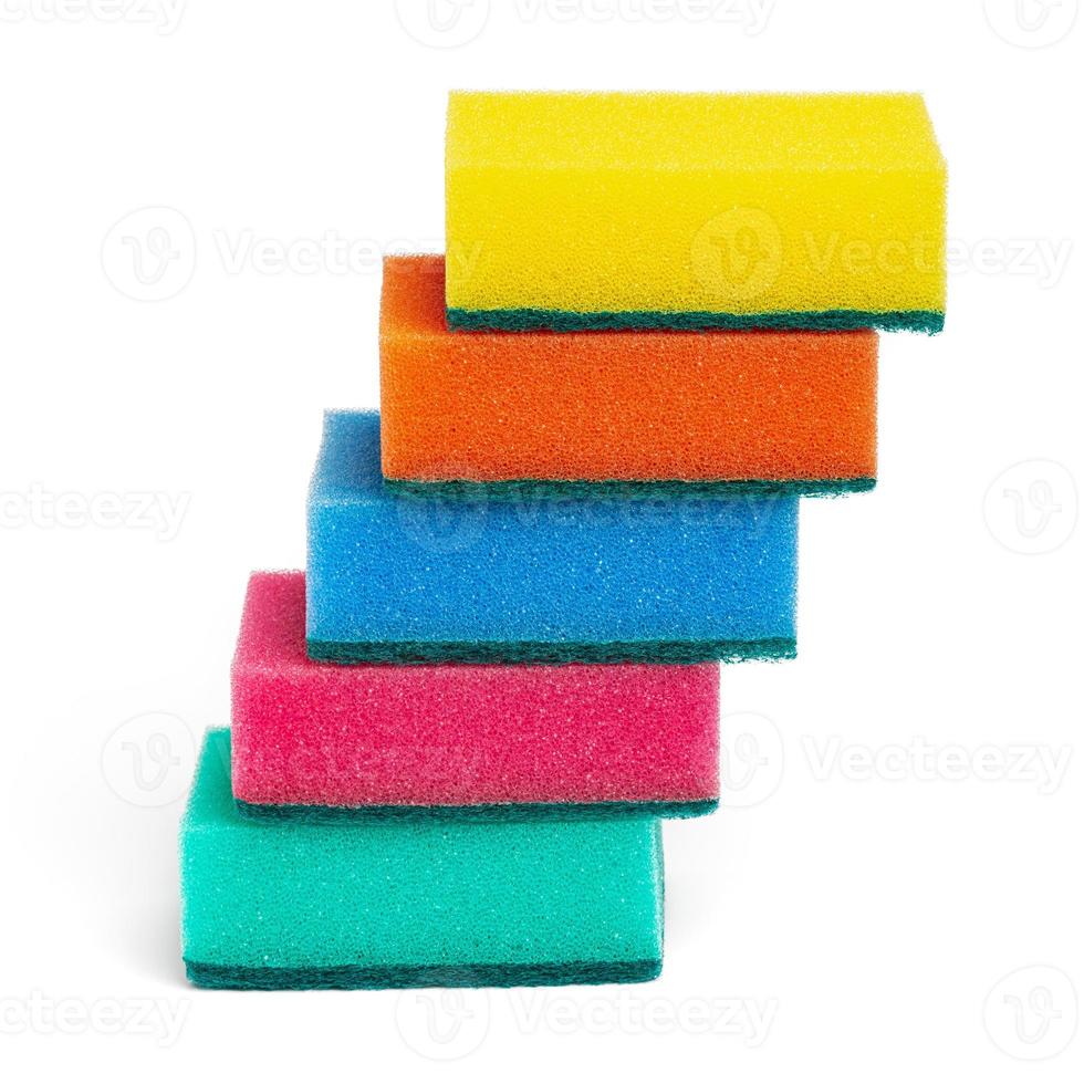 Foam sponges of yellow, orange, blue, pink and green colors for washing dishes, cleaning in kitchen photo