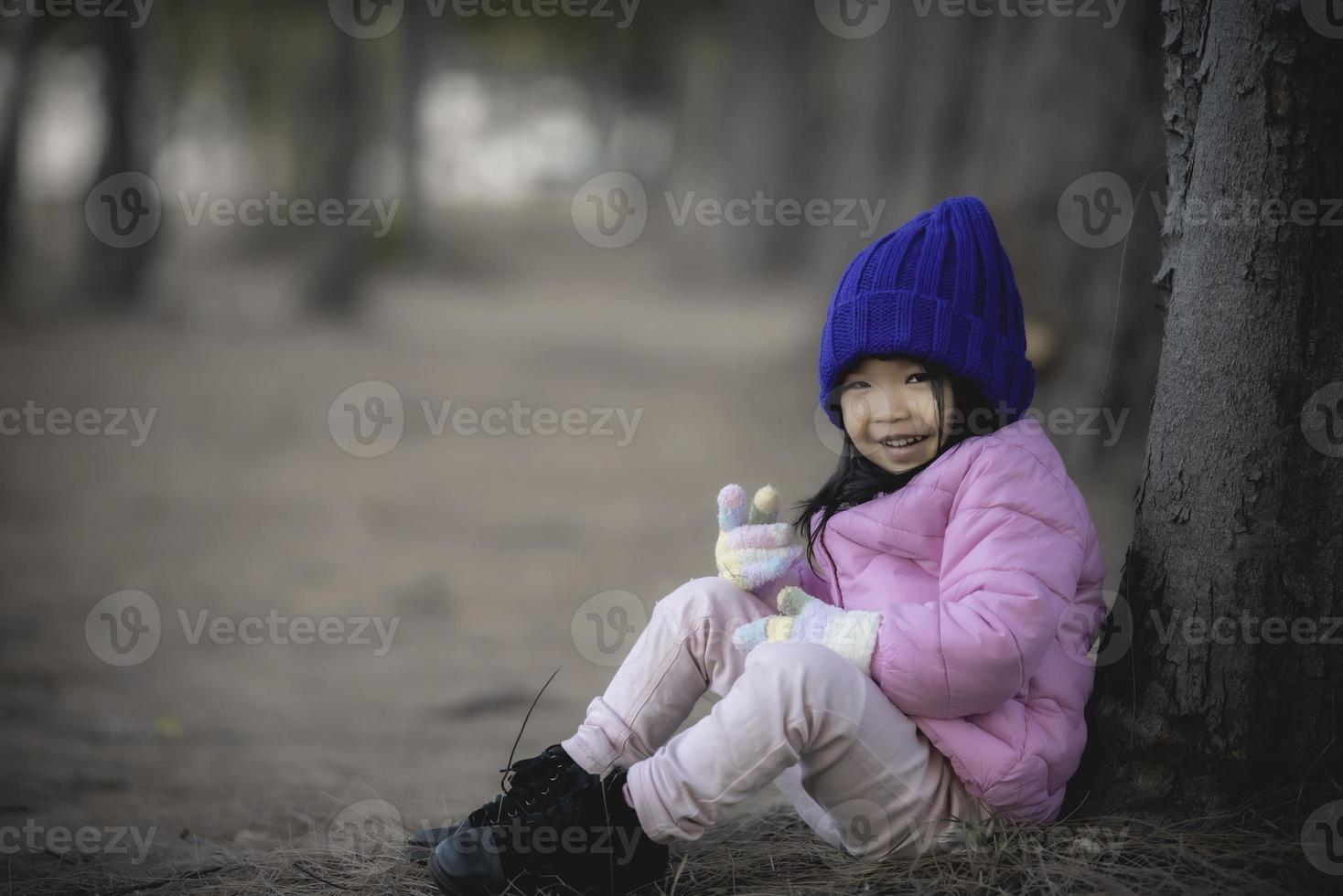 Portrait of asian little girl in weather cloth photo