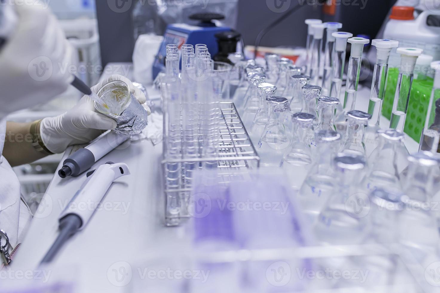 Asian scientist working in the lab,Doing experiment for product,The researchers analyzed to find the results of the experiment. photo