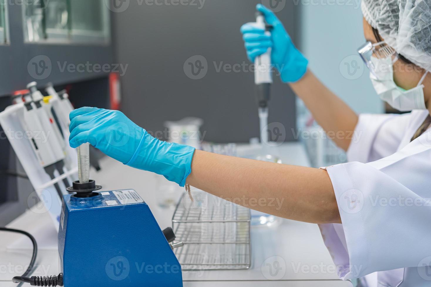 Asian scientist working in the lab,Doing experiment for product,The researchers analyzed to find the results of the experiment. photo