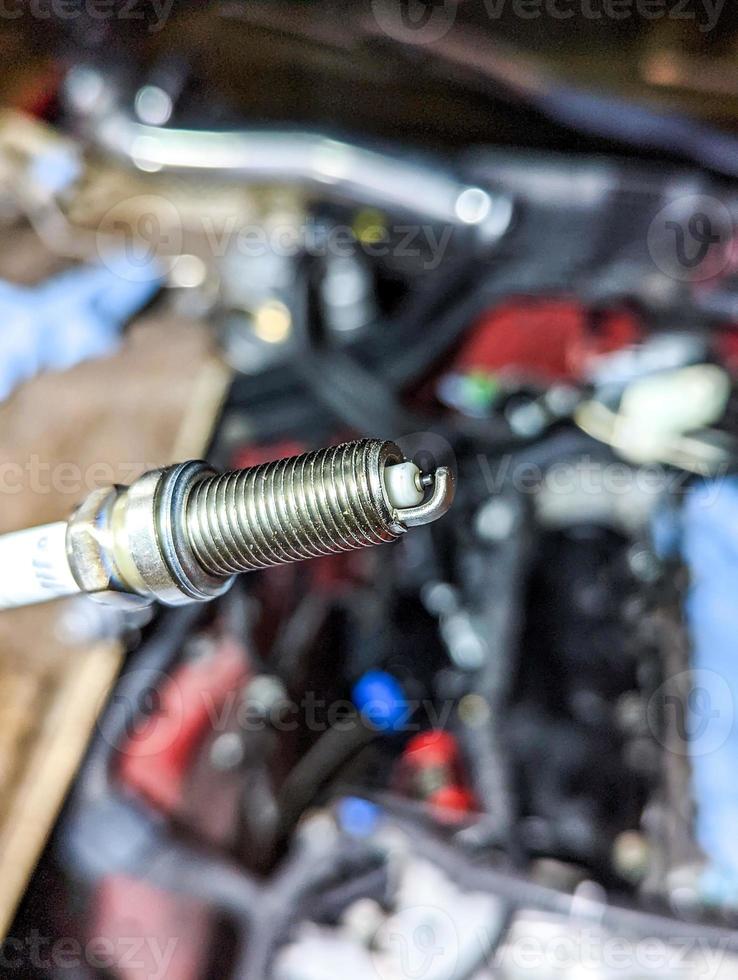 replacing spark plugs car service tune-up maintenance photo