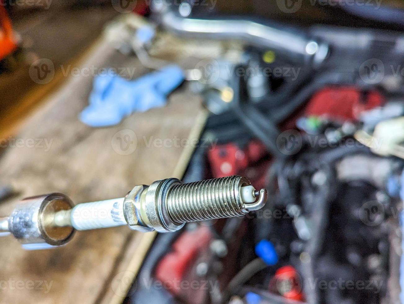 replacing spark plugs car service tune-up maintenance photo