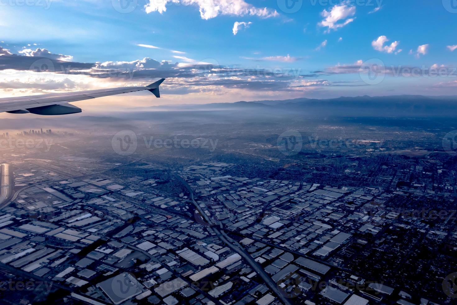 flying over city of los angeles at sunset photo