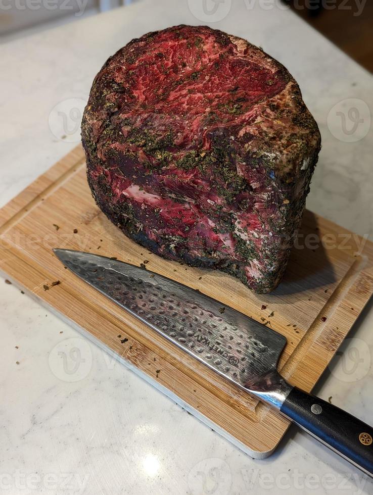 beautiful dry aged usda prime ribeye steak ready to grille photo