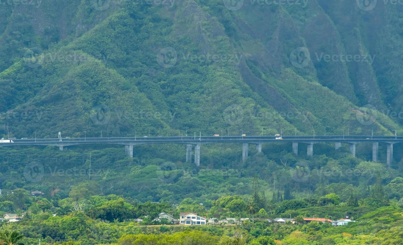 highway bridge in oahu hawaii mountains photo