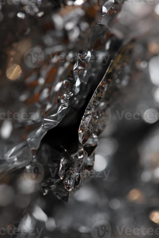 Abstract crumpled colorful aluminum foil texture close up modern background big size instant stock photography print photo