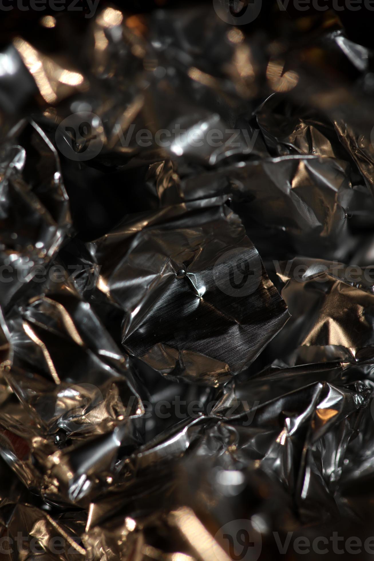 Crumpled Aluminum Foil Background Texture - in Gold Color Stock Photo