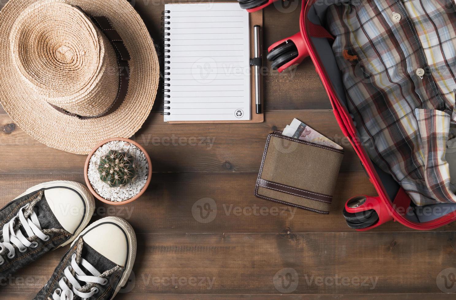 Travel preparations on wooden table photo