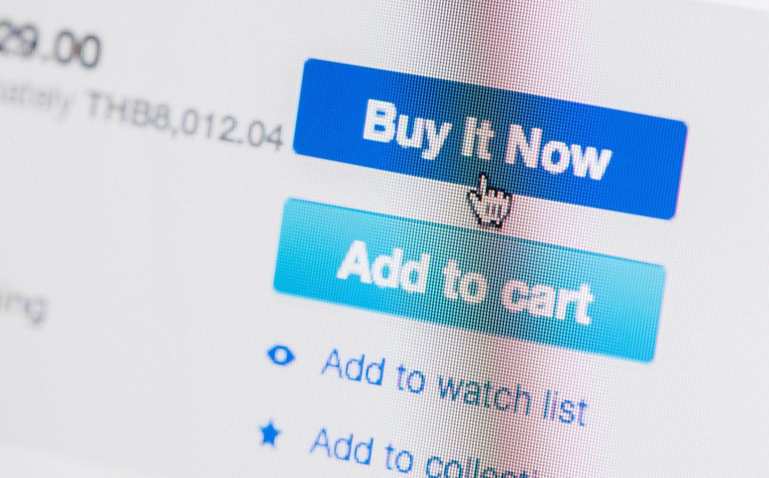 hand mouse cursor on buy it now button photo