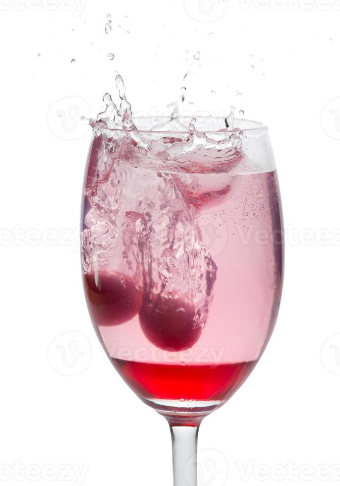 Red cocktail with splash isolated on white photo