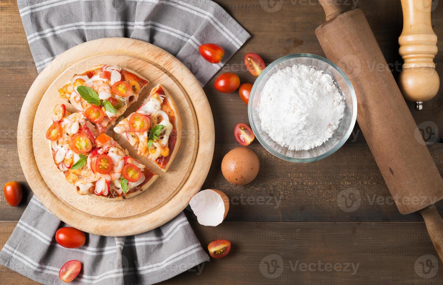pizza seafood on wood background photo