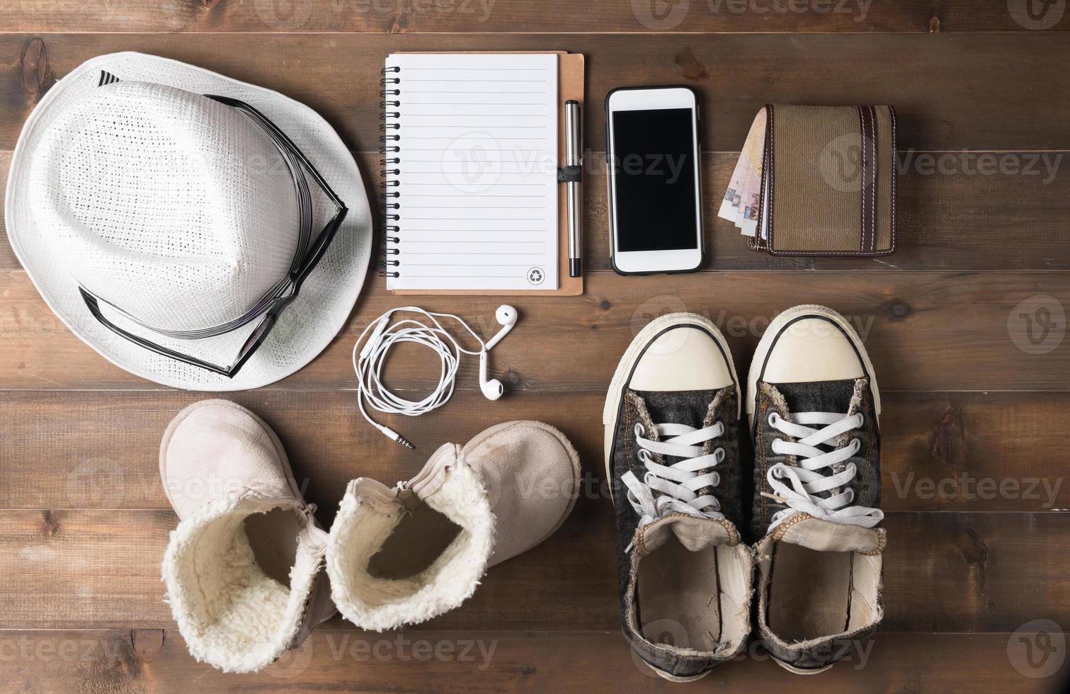 Travel preparations on wooden table photo