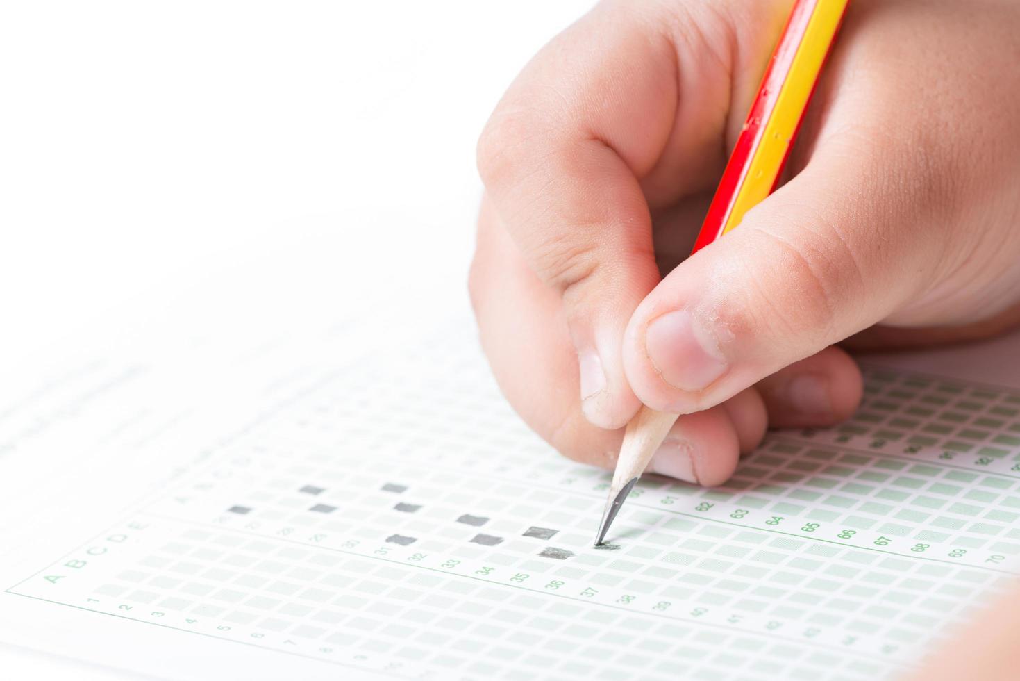 Hand choosing the test list on the examination photo