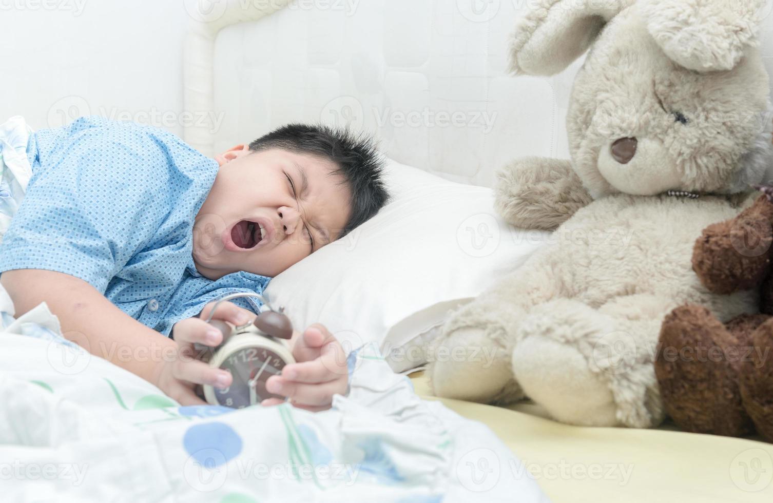cute boy wakes up and yawning. 21451740 Stock Photo at Vecteezy