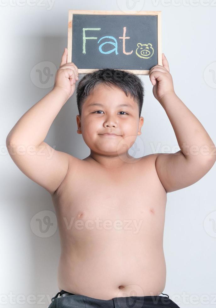 fat boy hold blackboard photo
