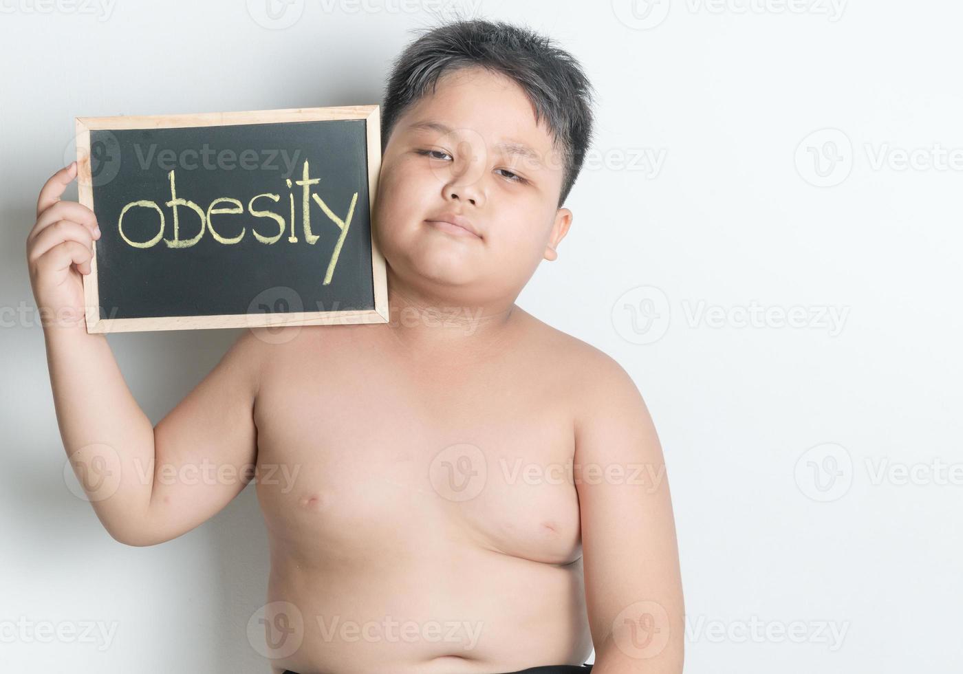 fat boy hold blackboard photo