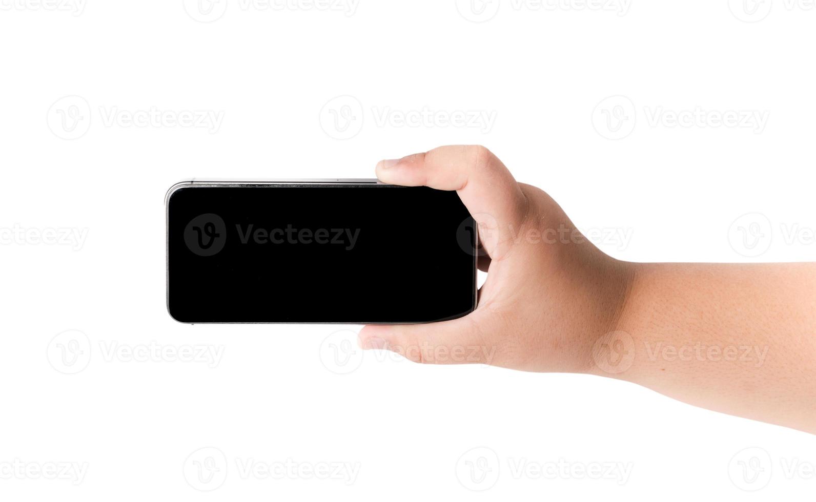 Mobile phone in boy hand isolated photo