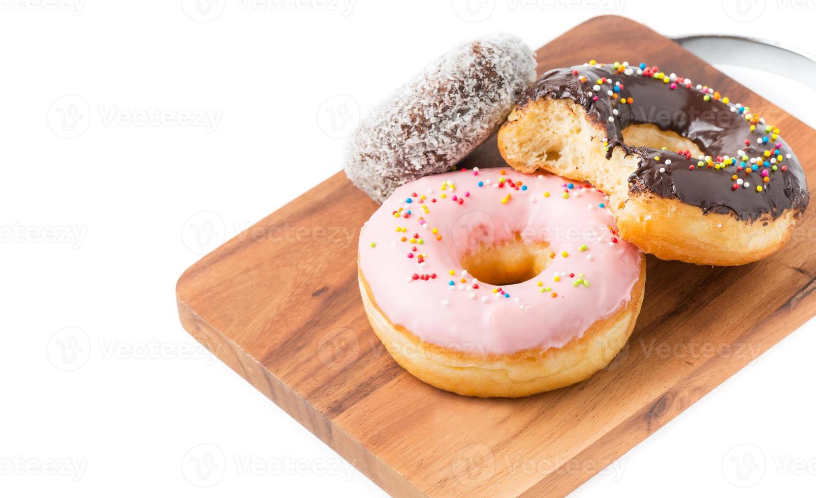 donut on wood block isolated photo