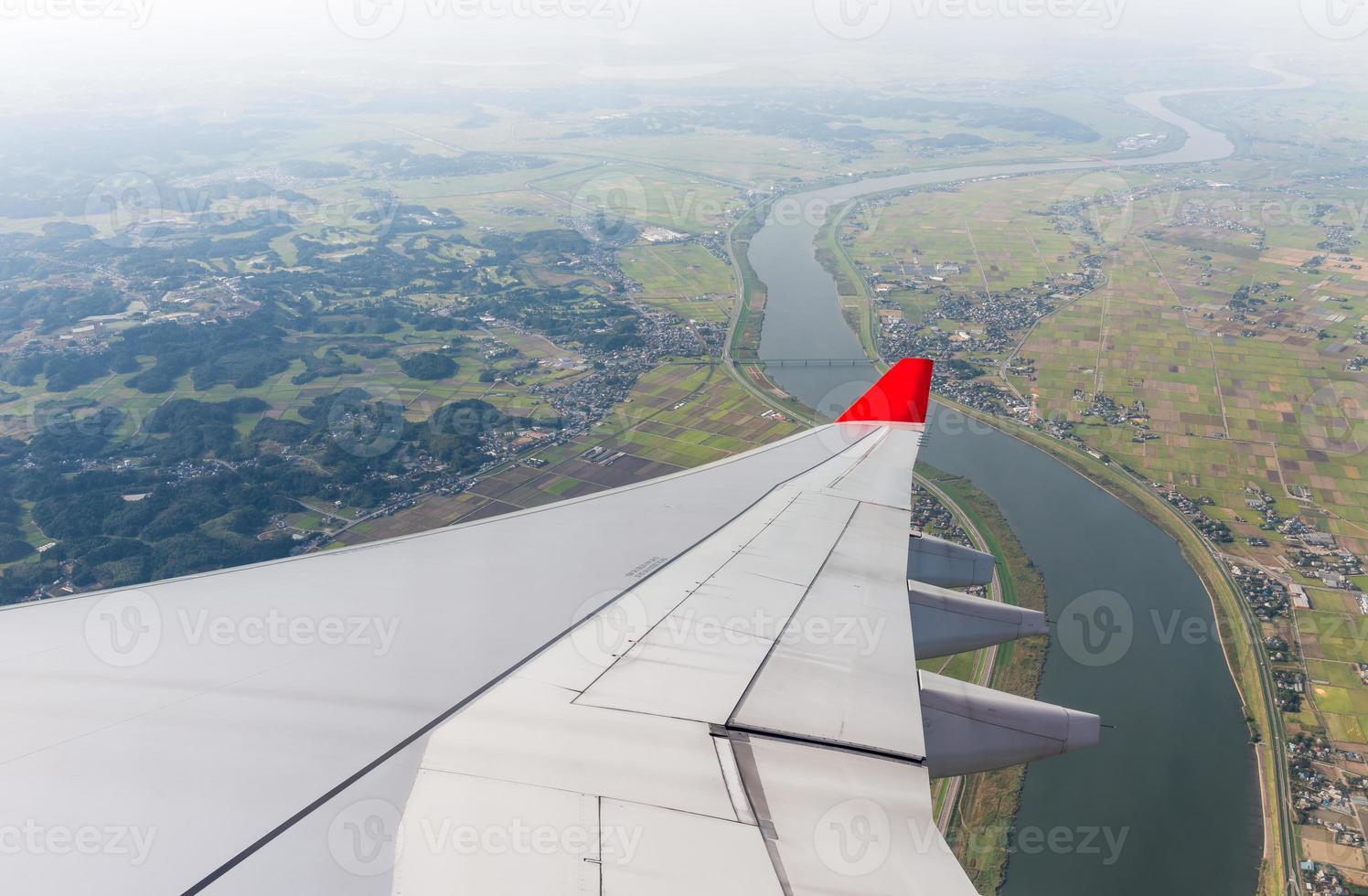 wing plane with river and landscape photo