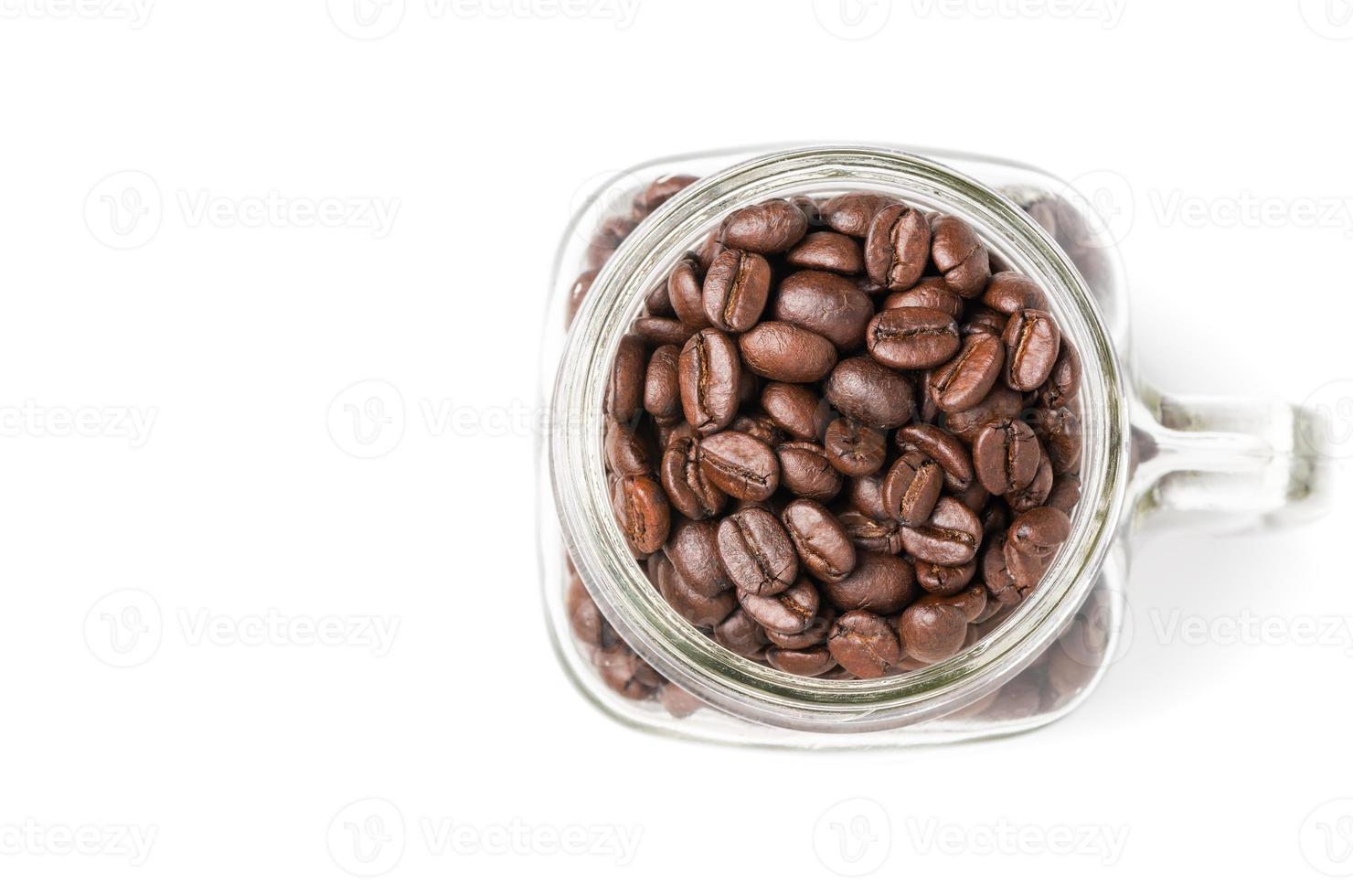 coffee beans in glass isolated on white photo