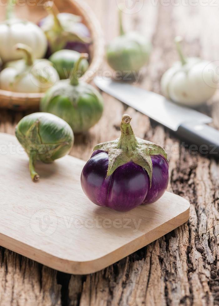 purple eggplant on wood background photo