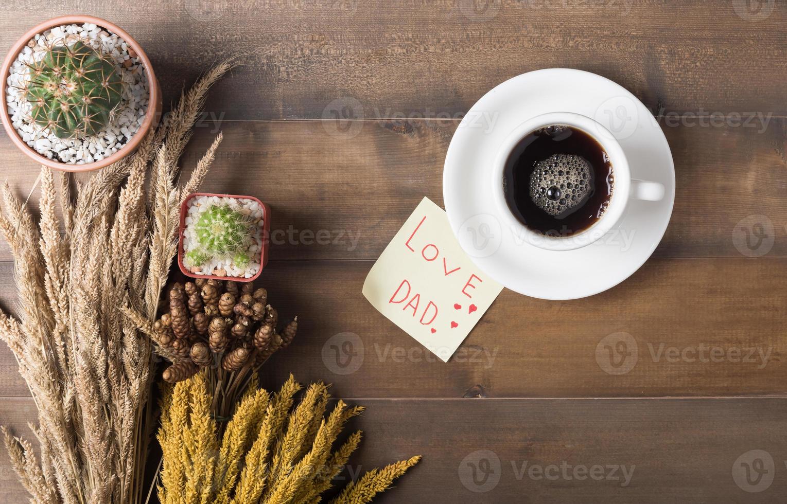 black coffee with paper note wood background photo