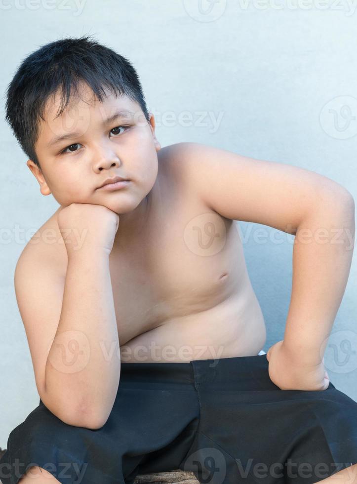 Portrait of handsome obese fat boy photo