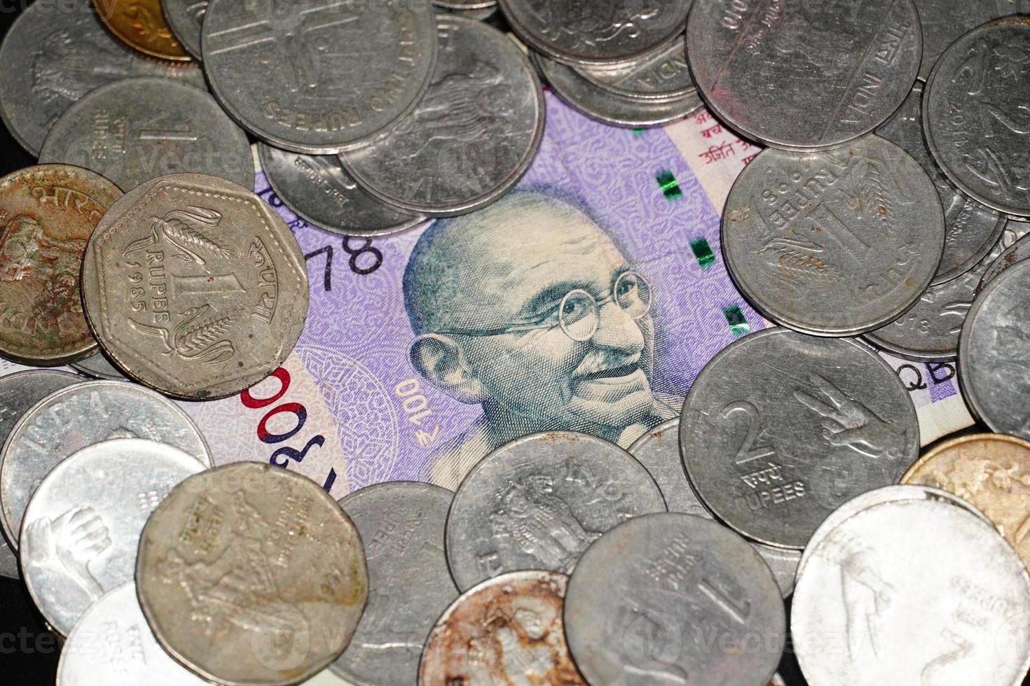 coins collection selective focus on gandhi. photo