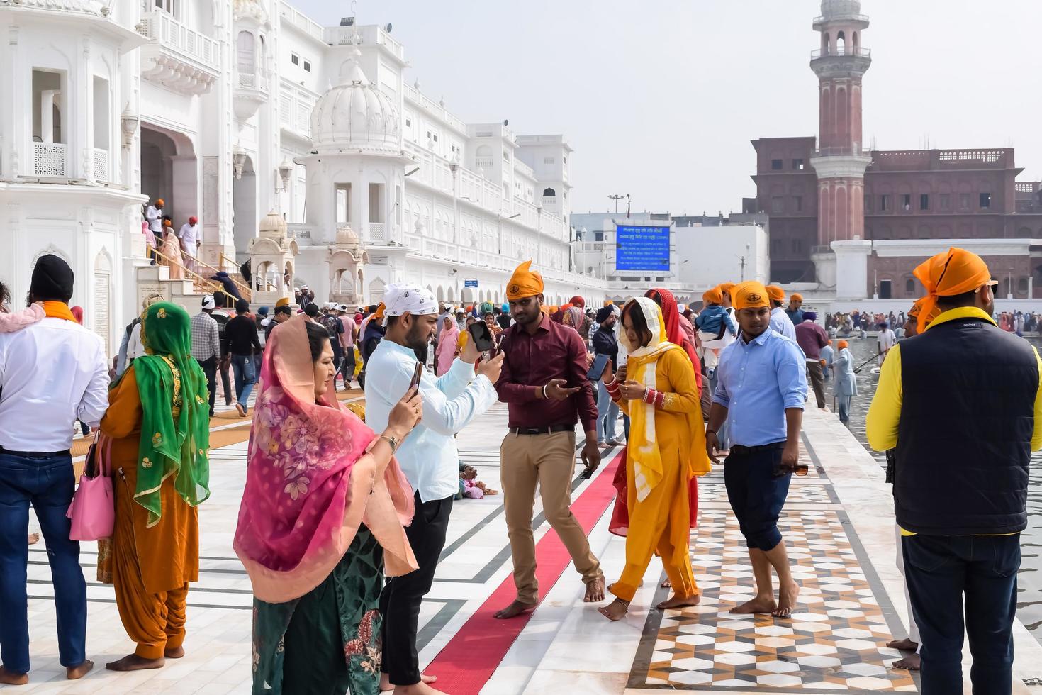 Amritsar, India - February 26 2023 - Unidentified devotees from various parts at Golden Temple - Harmandir Sahib in Amritsar, Punjab, India, Famous indian sikh landmark, Golden Temple photo