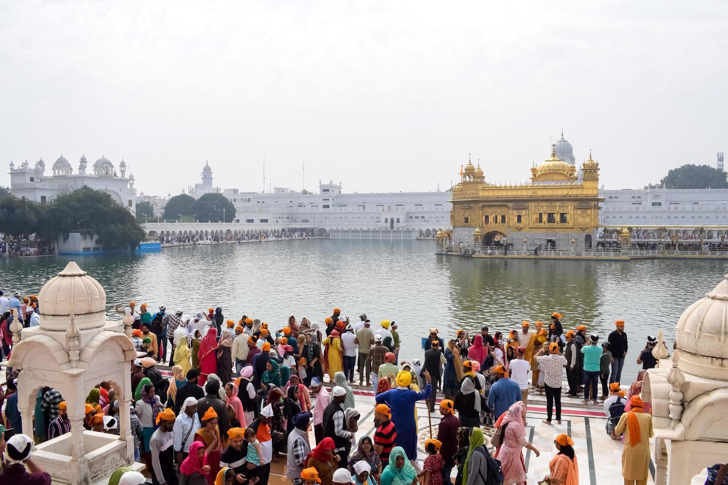 Amritsar, India - February 26 2023 - Unidentified devotees from various parts at Golden Temple Harmandir Sahib in Amritsar, Punjab, India, Famous indian sikh landmark, Golden Temple photo