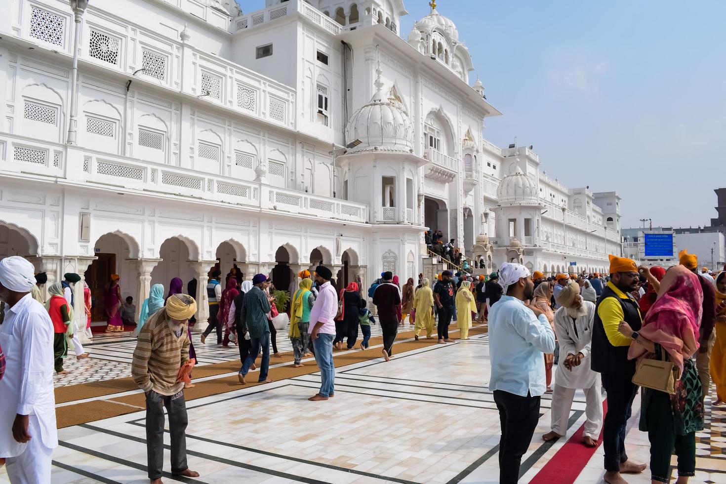 Amritsar, India - February 26 2023 - Unidentified devotees from various parts at Golden Temple - Harmandir Sahib in Amritsar, Punjab, India, Famous indian sikh landmark, Golden Temple photo