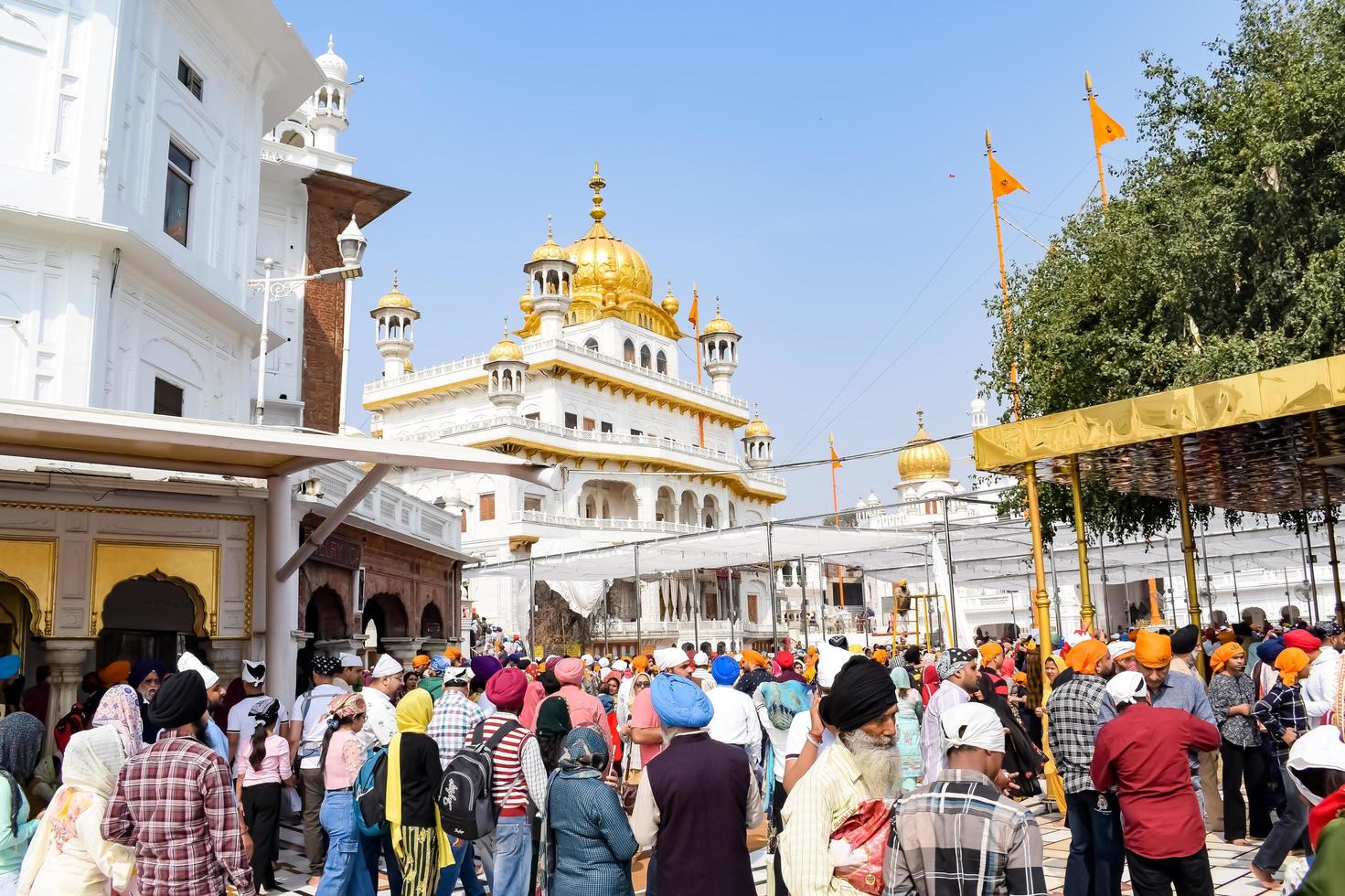 Amritsar, India - February 26 2023 - Unidentified devotees from various parts at Golden Temple Harmandir Sahib in Amritsar, Punjab, India, Famous indian sikh landmark, Golden Temple photo