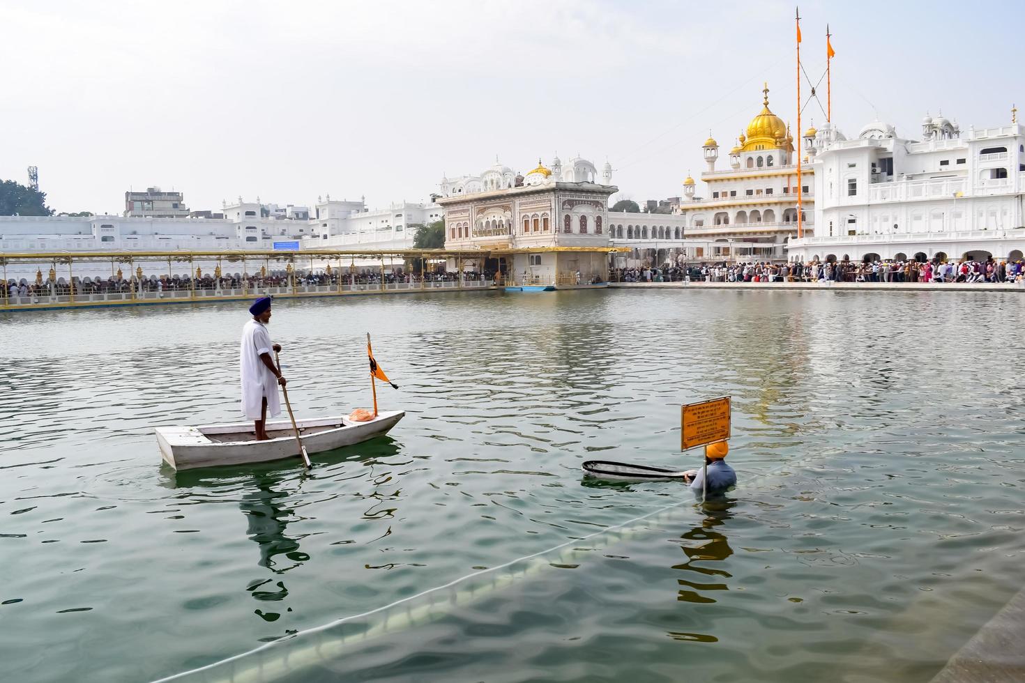 Amritsar, India - February 26 2023 - Unidentified devotees from various parts at Golden Temple Harmandir Sahib in Amritsar, Punjab, India, Famous indian sikh landmark, Golden Temple photo