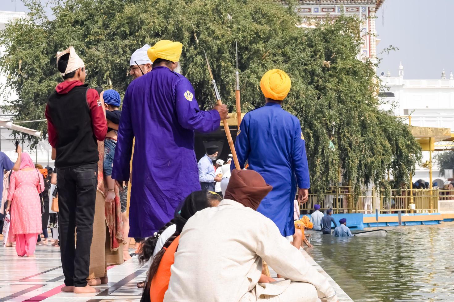 Amritsar, India - February 26 2023 - Unidentified devotees from various parts at Golden Temple - Harmandir Sahib in Amritsar, Punjab, India, Famous indian sikh landmark, Golden Temple photo