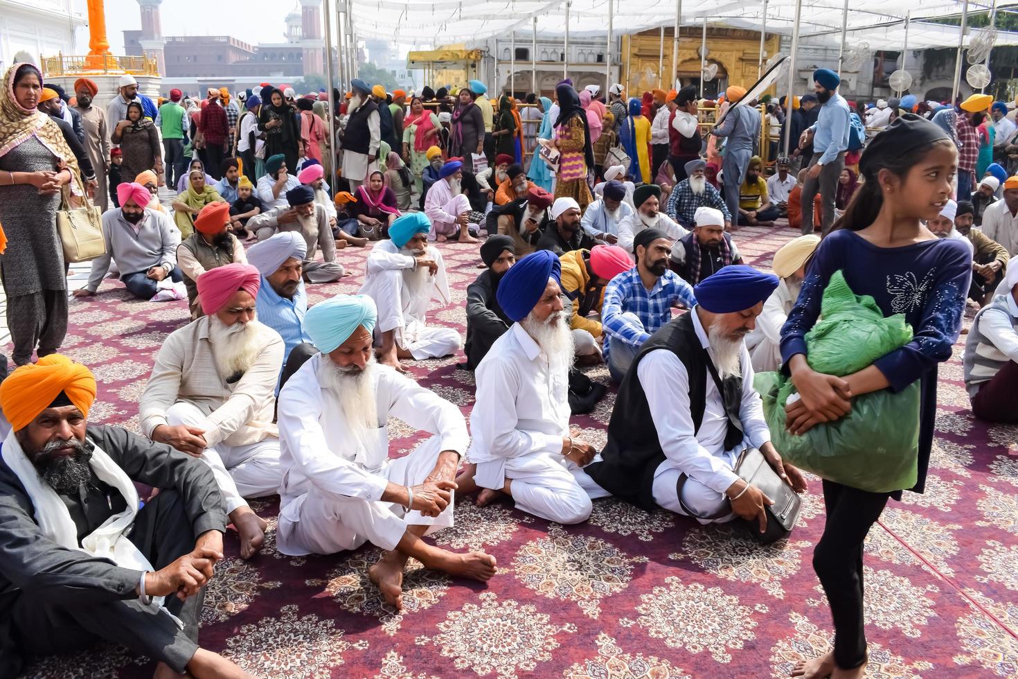 Amritsar, India - February 26 2023 - Unidentified devotees from various parts at Golden Temple - Harmandir Sahib in Amritsar, Punjab, India, Famous indian sikh landmark, Golden Temple photo