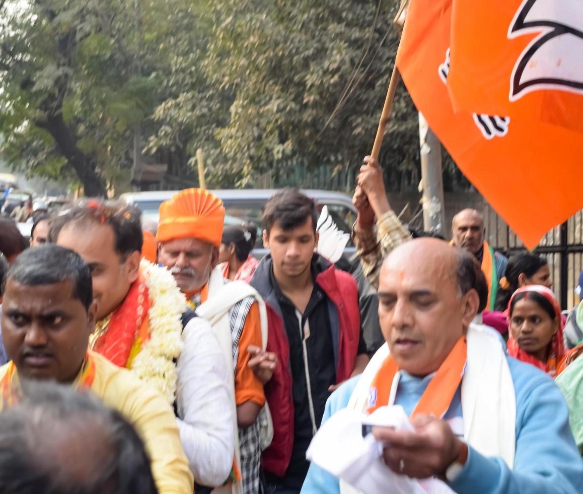 Delhi, India, December 02 2022 -Bharatiya Janata Party - BJP supporter during mega road show in support of BJP candidate Pankaj Luthara to file nomination papers ahead of MCD local body Elections 2022 photo