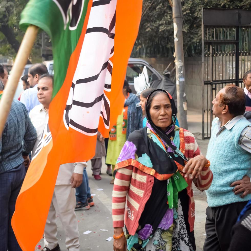 Delhi, India, December 02 2022 -Bharatiya Janata Party - BJP supporter during mega road show in support of BJP candidate Pankaj Luthara to file nomination papers ahead of MCD local body Elections 2022 photo