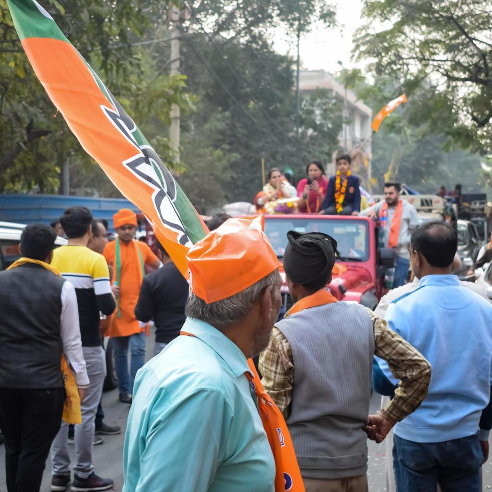 Delhi, India, December 02 2022 -Bharatiya Janata Party BJP supporter during mega road show in support of BJP candidate Pankaj Luthara to file nomination papers ahead of MCD local body Elections 2022 photo