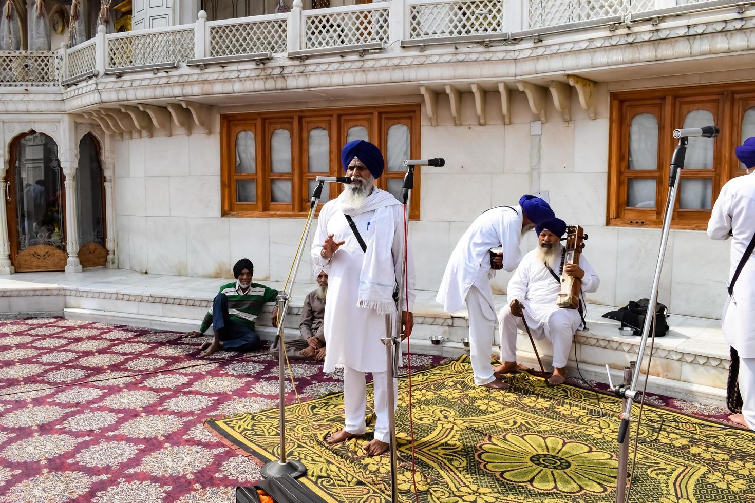 Amritsar, India - February 26 2023 - Unidentified devotees from various parts at Golden Temple - Harmandir Sahib in Amritsar, Punjab, India, Famous indian sikh landmark, Golden Temple photo