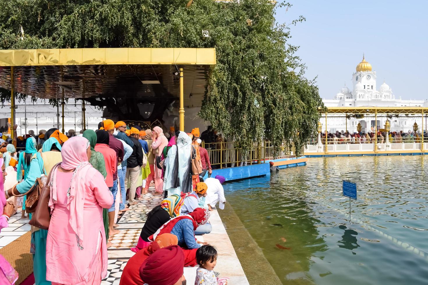 Amritsar, India - February 26 2023 - Unidentified devotees from various parts at Golden Temple - Harmandir Sahib in Amritsar, Punjab, India, Famous indian sikh landmark, Golden Temple photo