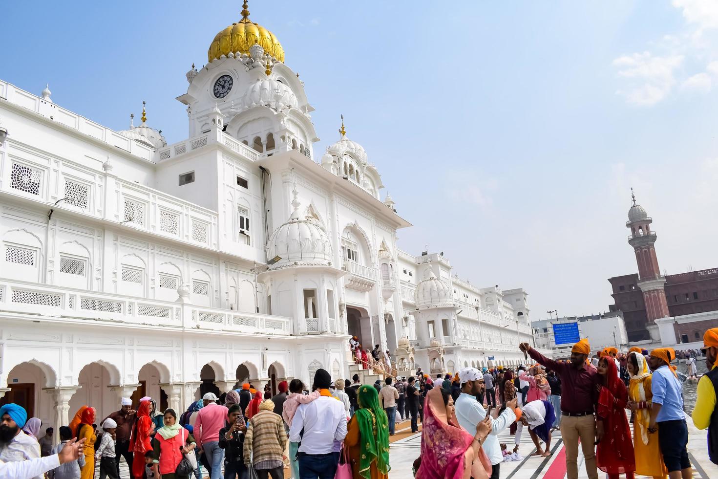 Amritsar, India - February 26 2023 - Unidentified devotees from various parts at Golden Temple Harmandir Sahib in Amritsar, Punjab, India, Famous indian sikh landmark, Golden Temple photo