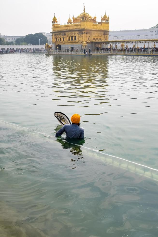Amritsar, India - February 26 2023 - Unidentified devotees from various parts at Golden Temple Harmandir Sahib in Amritsar, Punjab, India, Famous indian sikh landmark, Golden Temple photo